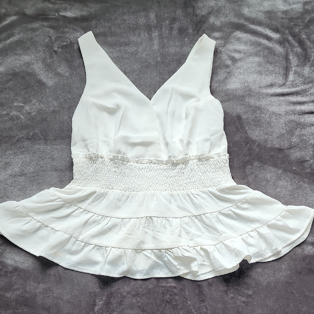 White Sleeveless Peplum Top